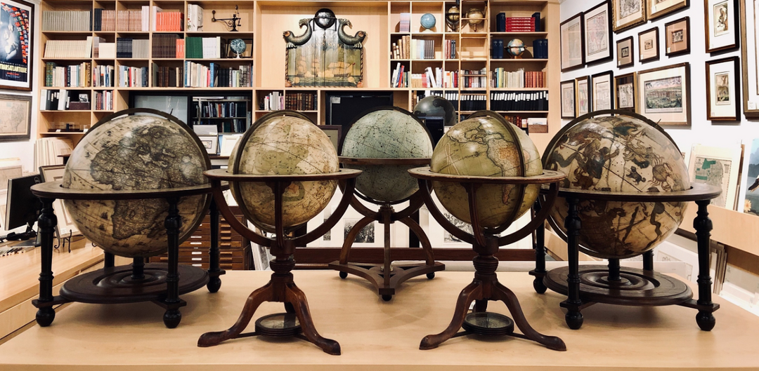Antique terrestrial and celestial globes displayed in The Antiquarium gallery